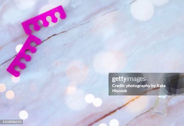 toe separators and nail varnish - toe separators stock pictures, royalty-free photos & images