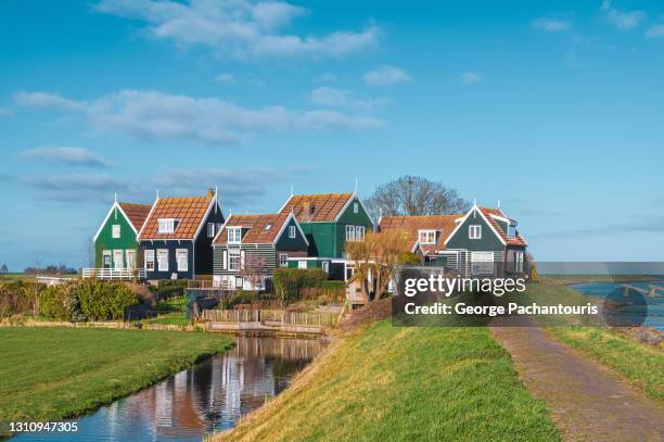 colorful houses in the village of marken, holland - north holland stock pictures, royalty-free photos & images