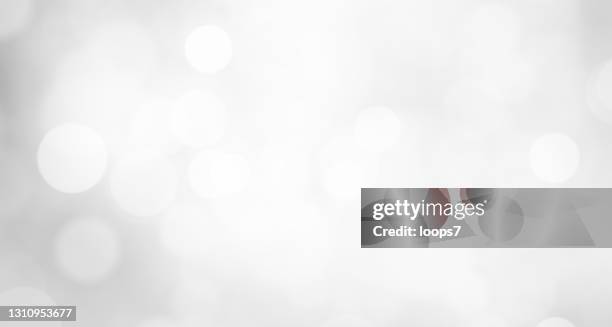 white defocused lights background - lens flare white background stock illustrations