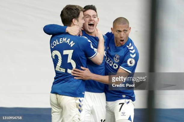 James Rodriguez of Everton celebrates with teammates Seamus Coleman and Richarlison after scoring their team's first goal during the Premier League...