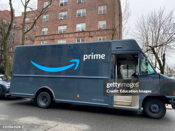 Amazon Prime delivery van outside residential building, Queens, New York.
