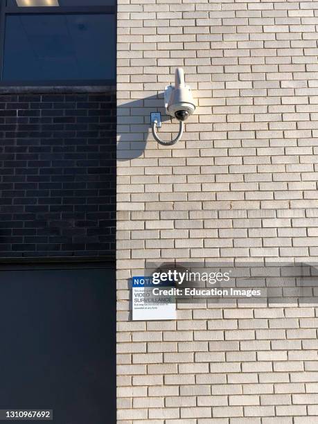 Video Surveillance sign under camera at public school, Queens, New York.