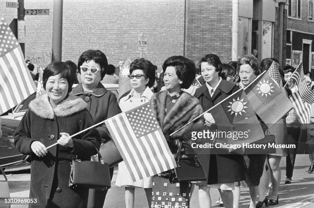 Representatives from the Chicago Chinese Community Center march through Chinatown for the Chinese Independence Day Parade in Chicago, Illinois,...