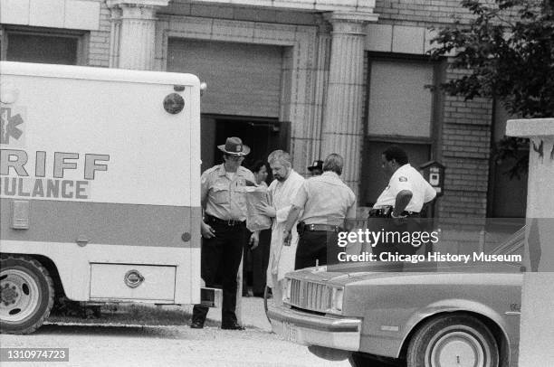 John Wayne Gacy is released from Cook County Hospital in Chicago, Illinois, and he is possibly being transferred to Cermak Hospital, August 28, 1979.