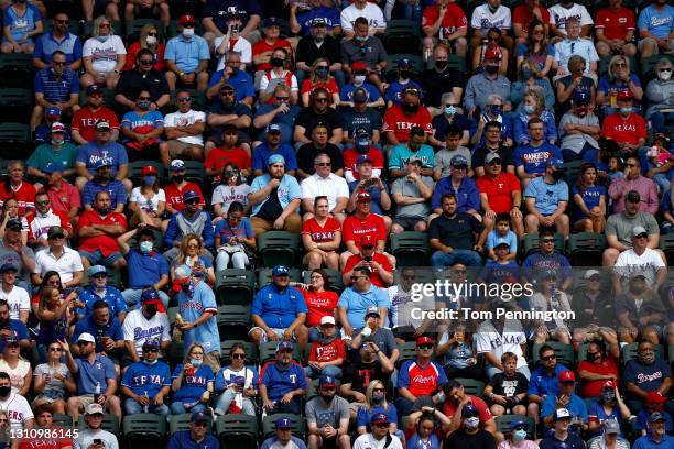 Fans look on as the Texas Rangers take on the Toronto Blue Jays in the fourth inning on Opening Day at Globe Life Field on April 05, 2021 in...