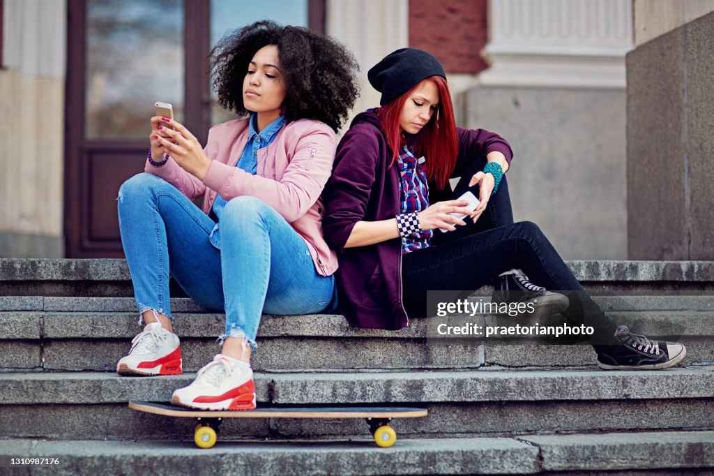 Girlfriends in conflict are texting and sulking each other