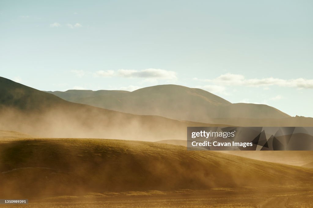 Dust storm over hills in nature