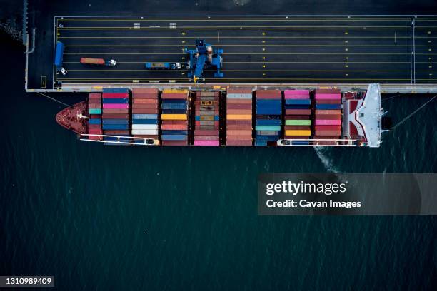 cargo ship with containers in port - barge stock pictures, royalty-free photos & images