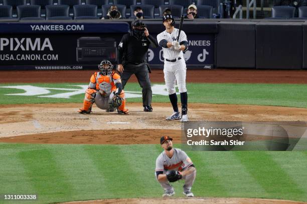 Giancarlo Stanton of the New York Yankees reacts as he hits a grand slam off of Shawn Armstrong of the Baltimore Orioles during the fifth inning at...