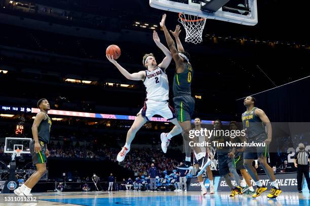 Drew Timme of the Gonzaga Bulldogs goes up to the basket against Flo Thamba of the Baylor Bears in the National Championship game of the 2021 NCAA...