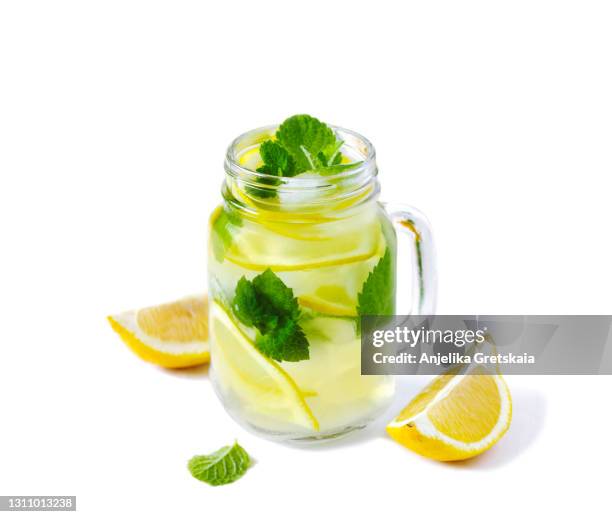 lemonade. mason jar glasses of lemonade with mint - メイソンジャー ストックフォトと画像