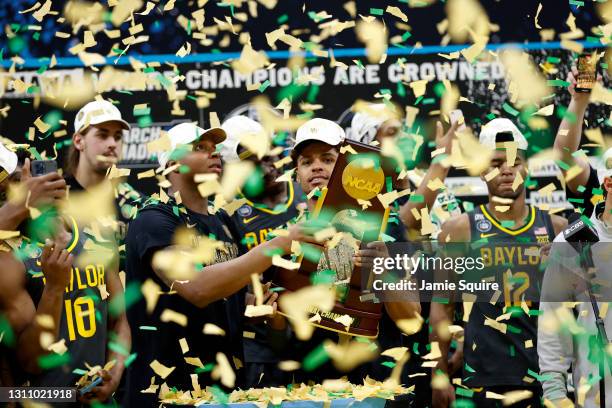 MaCio Teague and Mark Vital of the Baylor Bears hold up the trophy after defeating the Gonzaga Bulldogs 86-70 in the National Championship game of...