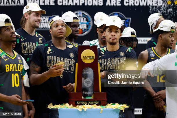 Mark Vital and MaCio Teague of the Baylor Bears look on with the trophy after defeating the Gonzaga Bulldogs 86-70 in the National Championship game...