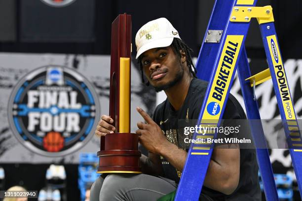 Davion Mitchell of the Baylor Bears poses with the trophy after defeating the Gonzaga Bulldogs in the National Championship game of the 2021 NCAA...