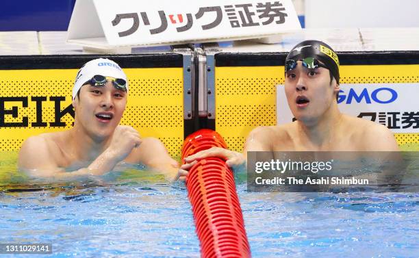 Daiya Seto and Masato Sakai react after competing in the Men's 200m Butterfly heat on day three of the 97th Japan Swimming Championships at the Tokyo...