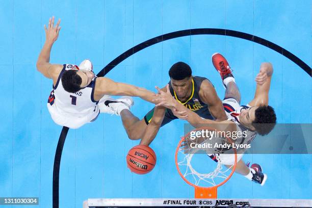 Jared Butler of the Baylor Bears drives to the basket against Jalen Suggs and Anton Watson of the Gonzaga Bulldogs during the second half in the...