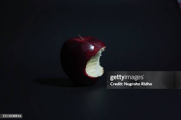 one bite of apple - かじりかけ ストックフォトと画像