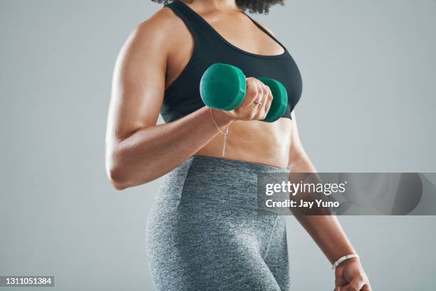 grab those weights for an upper body muscle boost - voluptuous stock pictures, royalty-free photos & images