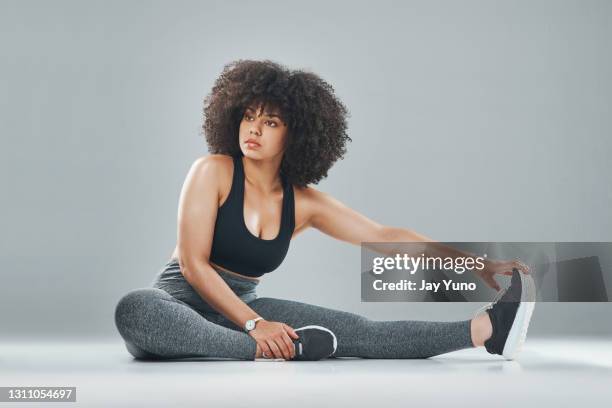 muscles function best after giving them a good stretch - plus size model fitness stock pictures, royalty-free photos & images