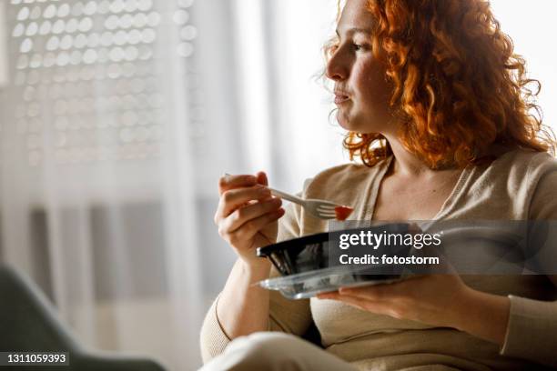 contemplating while eating take out food - ready to eat stock pictures, royalty-free photos & images