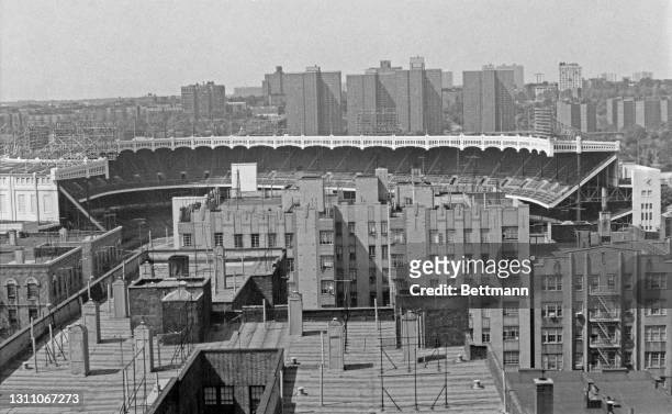 Yankee Stadium, home ground of the New York Yankees, boxed in by buildings of the Bronx, New York City, New York, 6th September 1972. Constructed in...