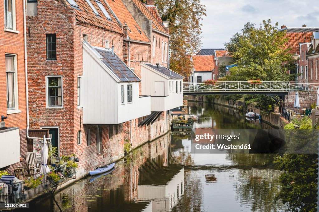 Netherlands, Groningen Province, Appingedam, Hanging kitchens over Damsterdiep canal