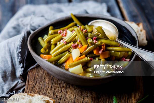 bean stew with green beans, carrots, potatoes - green bean stock pictures, royalty-free photos & images