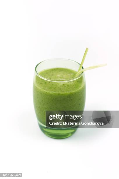 Green Fruit And Vegetable Smoothie In A Glass Cup On A White Isolated Background High-Res Stock Photo