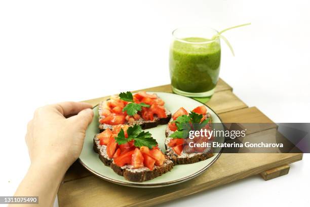 Closeup Of A Healthy Diet Breakfast With A Womans Hand On A White Background High-Res Stock Photo