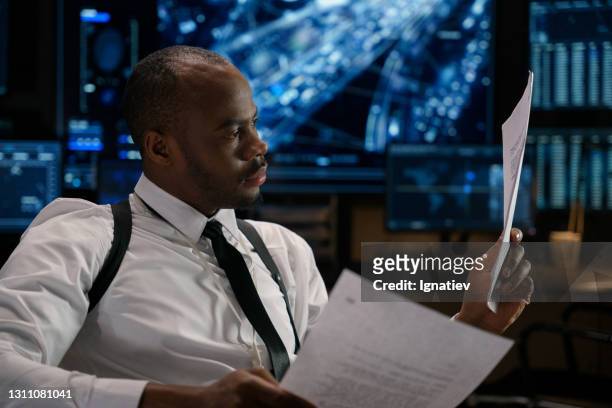 federal agent at his work place stock photo - detective stock pictures, royalty-free photos & images