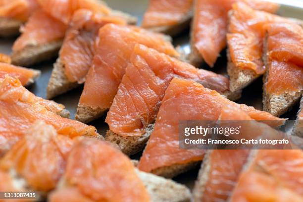 bread, butter and smoked salmon - sandwich triangle stock pictures, royalty-free photos & images