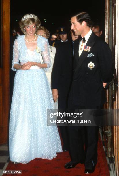 Prince Charles, Prince of Wales and Diana, Princess of Wales, wearing a pale blue dress with polka dots designed by Elizabeth and David Emanuel and...