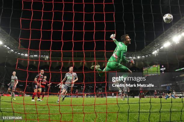 Mark Birighitti of the Mariners watches a header by Thomas Aquilina of the Wanderers hit the crossbar during the A-League match between Western...