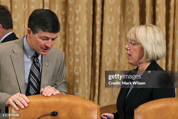 Co-chairman, Rep. Jeb Hensarling , talks with Sen. Patty Murray , during a Joint Deficit Reduction Committee hearing on Capitol Hill, on November 1,...