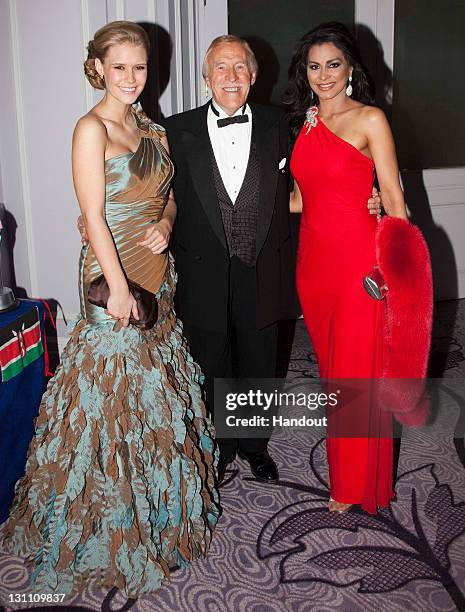 In this handout provided by Miss World Ltd, Sir Bruce Forsyth poses with his wife Wilnelia , a former Miss World, and the current Miss World 2010...