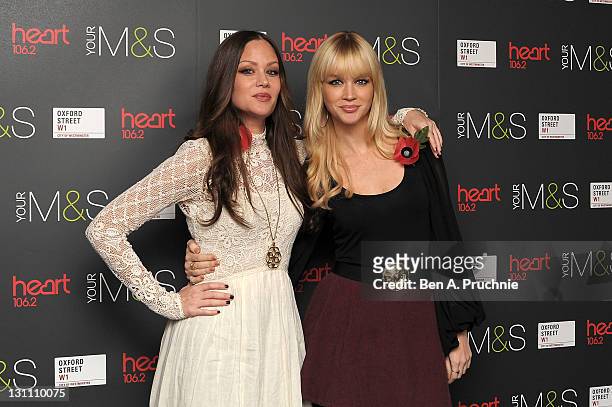 Catherine Pierce and Alison Pierce of "The Pierces" attend the switch on of the Oxford Street Christmas Lights on November 1, 2011 in London, England.