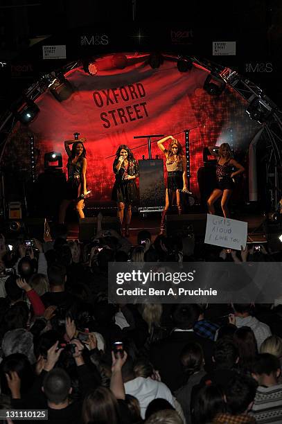 Una Healy, Rochelle Wiseman, Mollie King and Vanessa White of "The Saturdays" perform during the switch on of the Oxford Street Christmas Lights on...