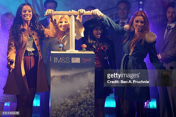 Una Healy, Rochelle Wiseman, Mollie King and Vanessa White of "The Saturdays" Switch On Oxford Street Christmas Lights on November 1, 2011 in London,...