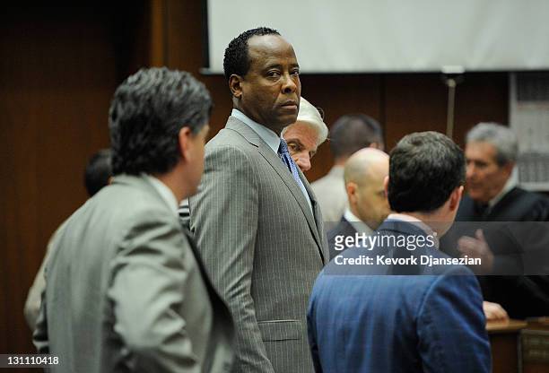 Dr. Conrad Murray, surrounded by his defense attorneys, looks on after the defense rested their case in his involuntary manslaughter trial in the...