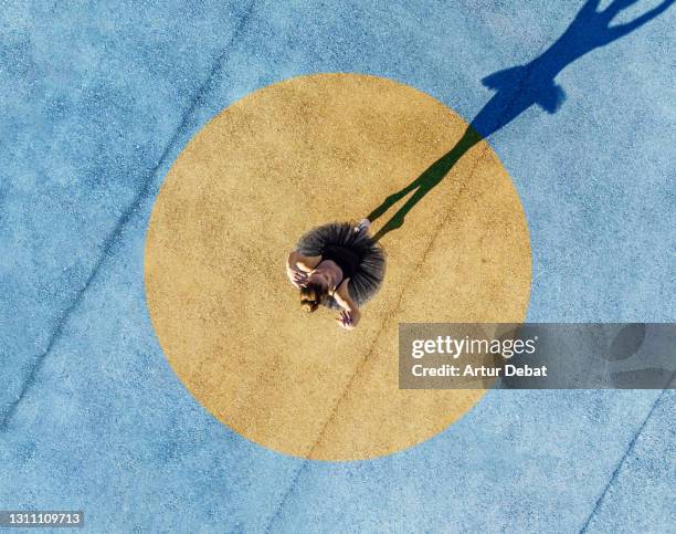 directly above view of a girl dancing ballet with social distancing and colors. - harmony fotografías e imágenes de stock