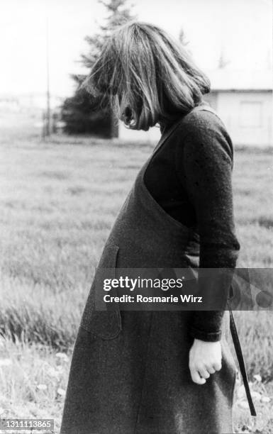 pregnant woman in her thirties looking down - unrecognizable person stock pictures, royalty-free photos & images