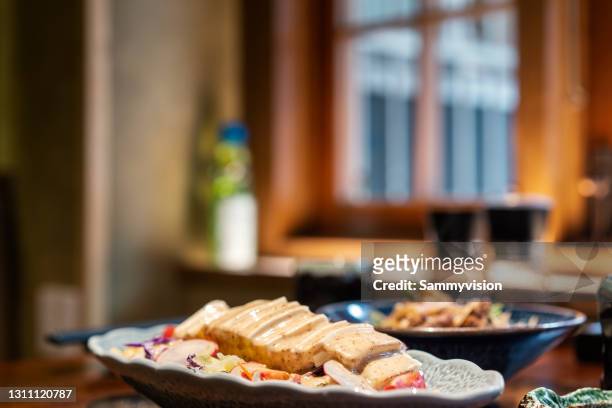 close-up of variation of japanese food on table - izakaya stock pictures, royalty-free photos & images