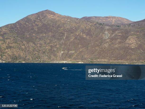 state forestry corps helicopter (elicottero del corpo forestale dello stato) on lake maggiore - elicottero stock pictures, royalty-free photos & images