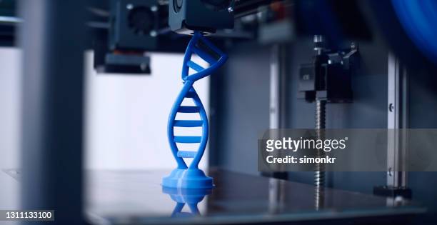 3d printer breaking dna structure model in half - 3 d printer stock pictures, royalty-free photos & images