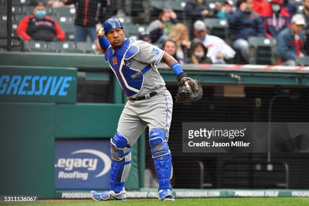 Catcher Salvador Perez of the Kansas City Royals throws the ball during the second inning of the home opener against the Cleveland Indians at...