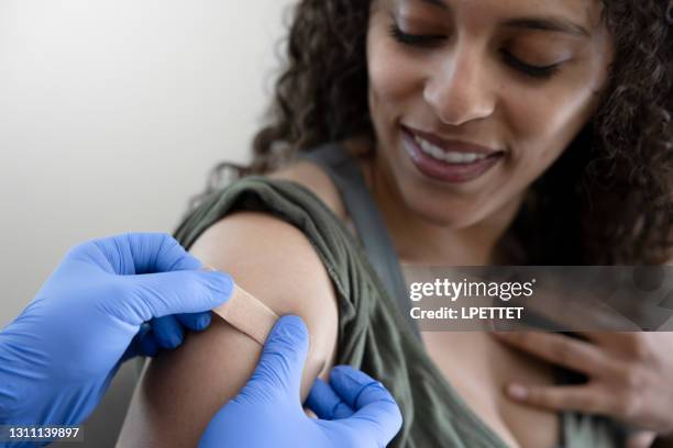 vaccinated - young adult vaccine stock pictures, royalty-free photos & images