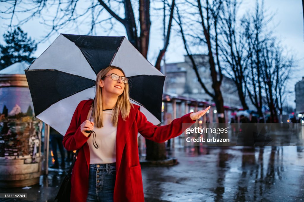 Woman Checking Is It Still Raining High-Res Stock Photo - Getty Images