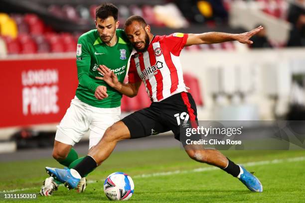 Bryan Mbeumo of Brentford battles for possession with Maxime Colin of Birmingham City during the Sky Bet Championship match between Brentford and...