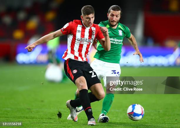 Vitaly Janelt of Brentford battles for possession with Ivan Sunjic of Birmingham City during the Sky Bet Championship match between Brentford and...