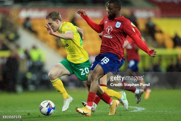 Oliver Skipp of Norwich City is fouled for a penalty by Isaac Mbenza of Huddersfield Town during the Sky Bet Championship match between Norwich City...